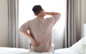 Patient suffering from chronic back pain seeking TCM acupuncture.